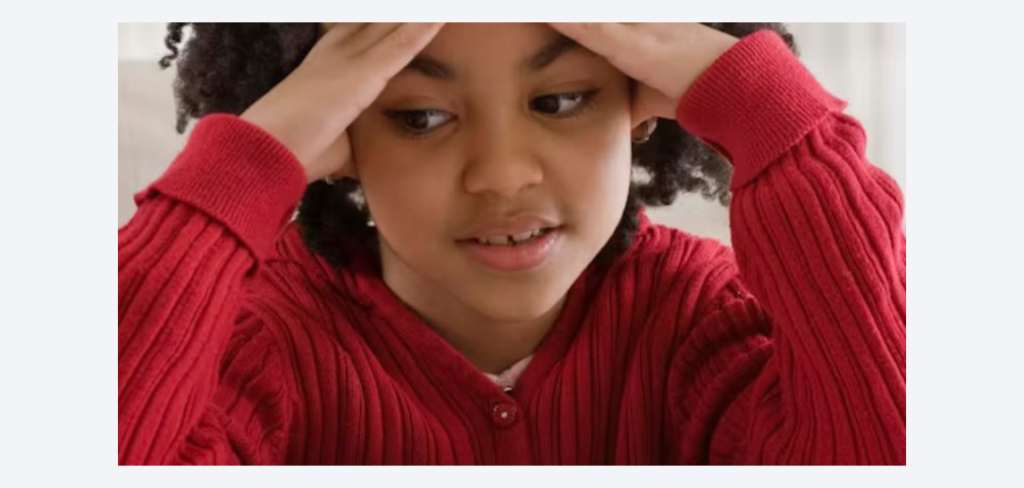 Young student feeling overwhelmed and stressed during studies